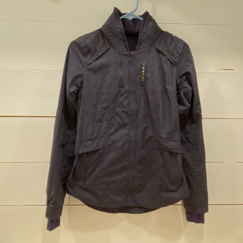 Running zip up with hidden hood